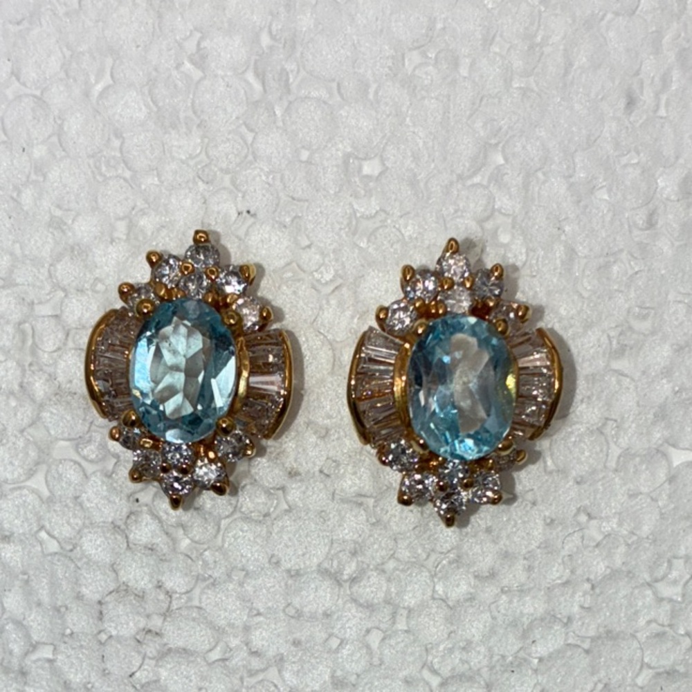 Blue topaz and rhinestone gold toned pierced earrings